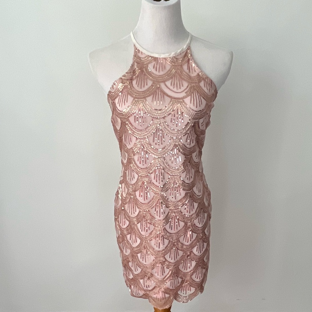 Blush pink scalloped sequin halter dress with a back zipper closure